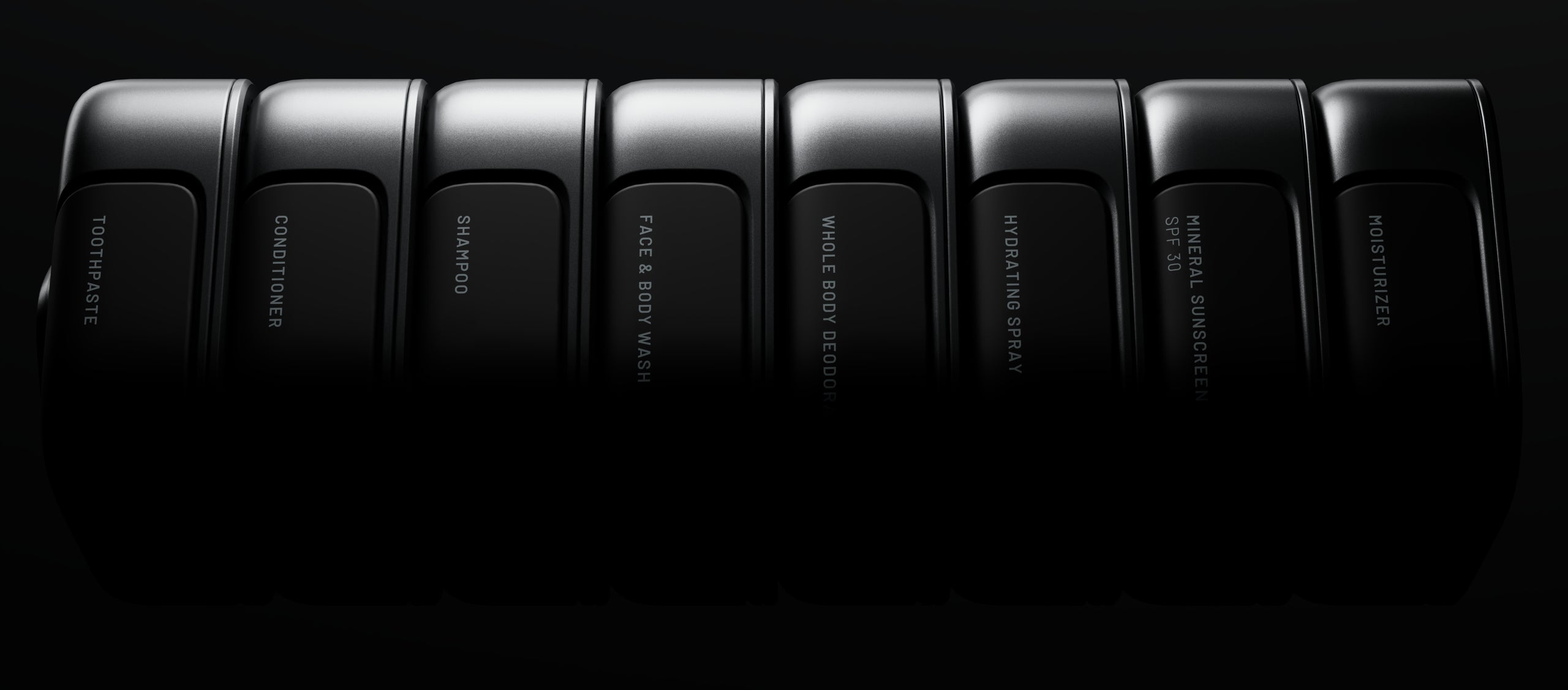 Eight BOXBOX modules assembled into a horizontal row, emerging from shadow.